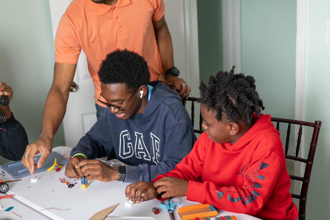 Island Innovators Bahamas 2025 students building a robotics project