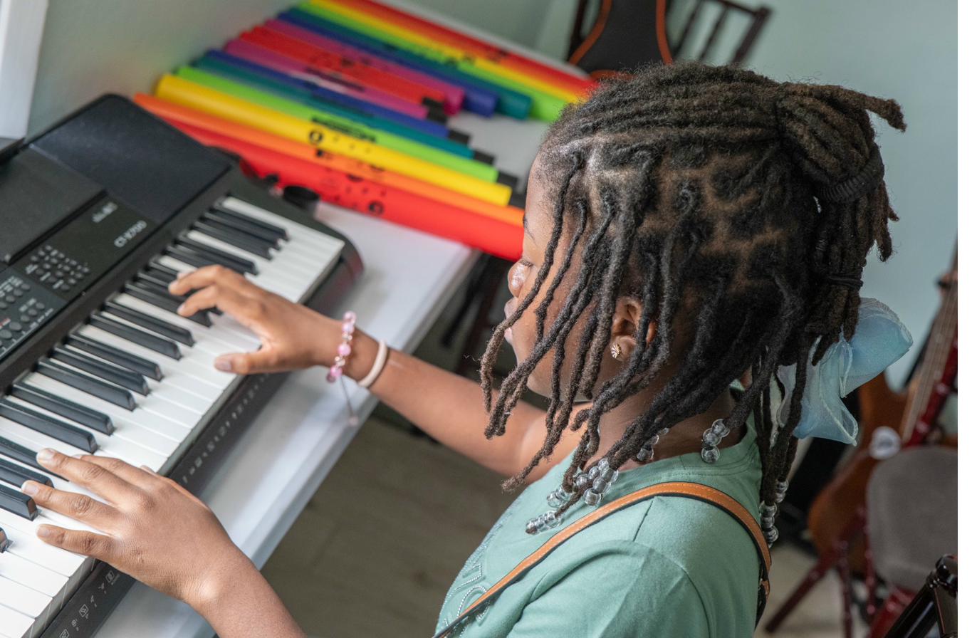 Student at keyboard during Island Innovators Bahamas 2025