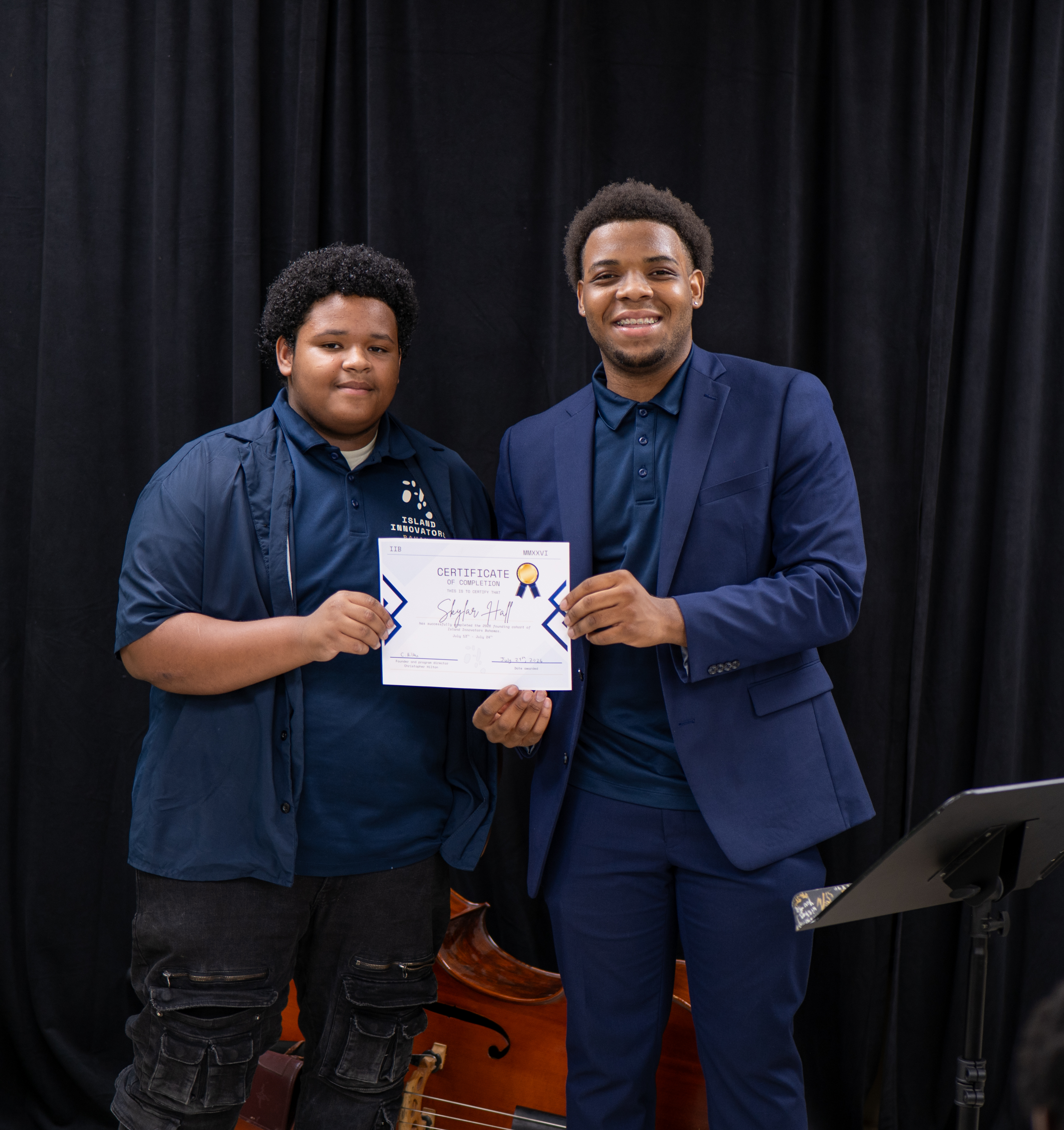 Island Innovators Bahamas 2026 student receiving a certificate of completion at the public showcase